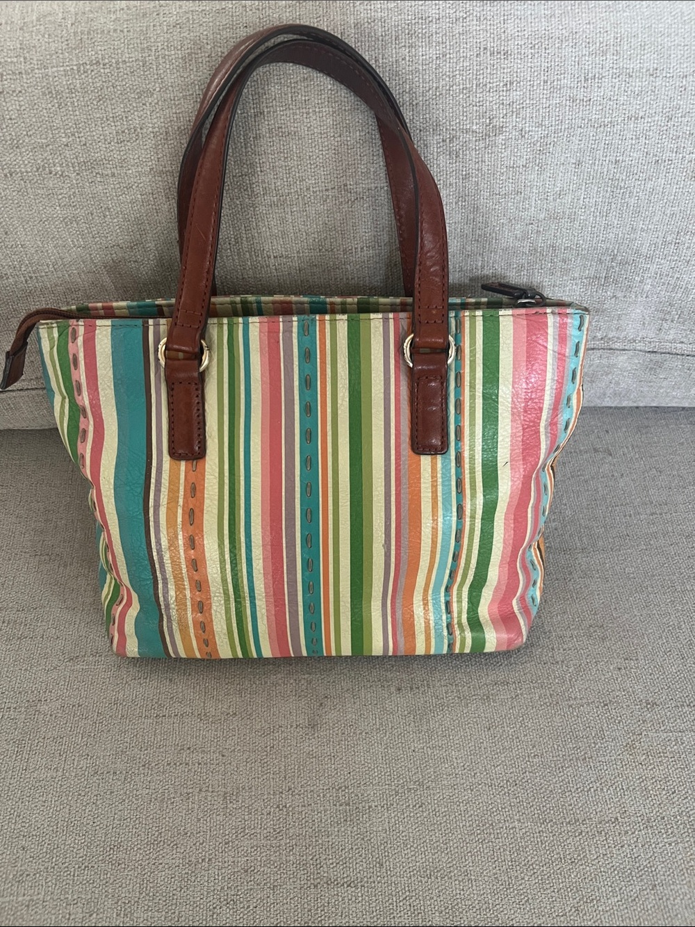 Vintage Fossil 1954 satchel bag featuring a multicolored striped leather design.